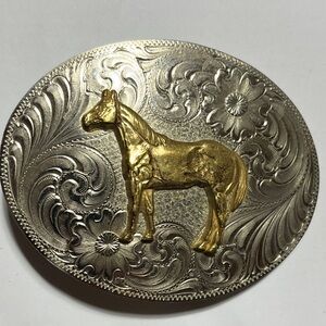 Montana Silversmith Horse belt buckle with decorative swirl.